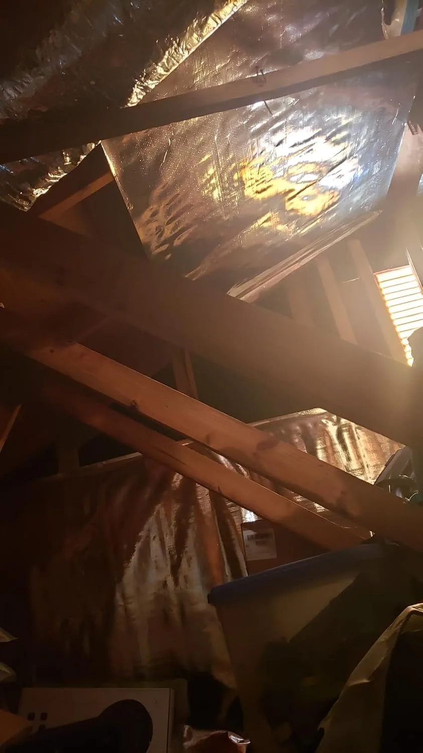 Customer photo of radiant barrier foil installed in attic space between rafters
