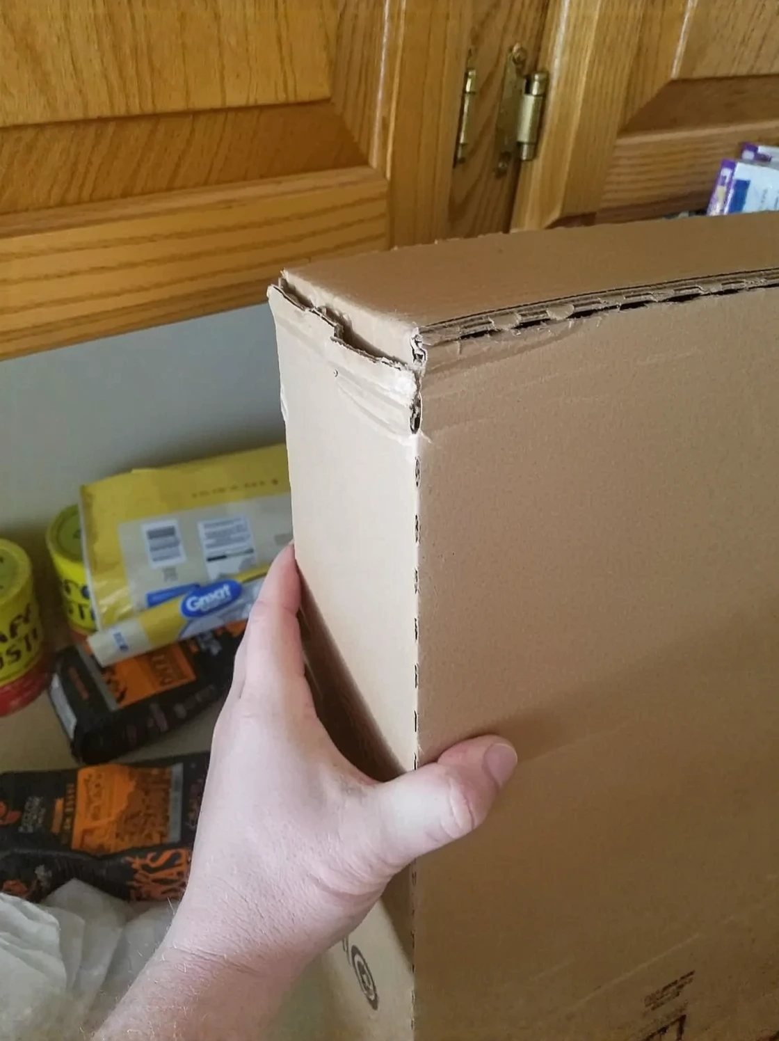 Customer photo of MERV 8 filter held up showing dust accumulation and filter material density
