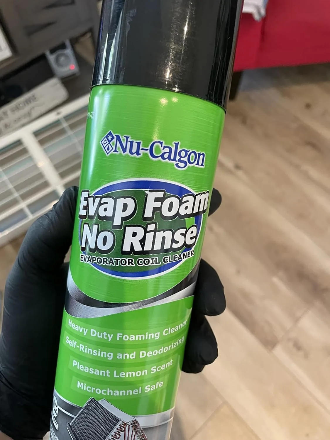 Customer photo of HVAC system filter being inspected during routine maintenance tune-up