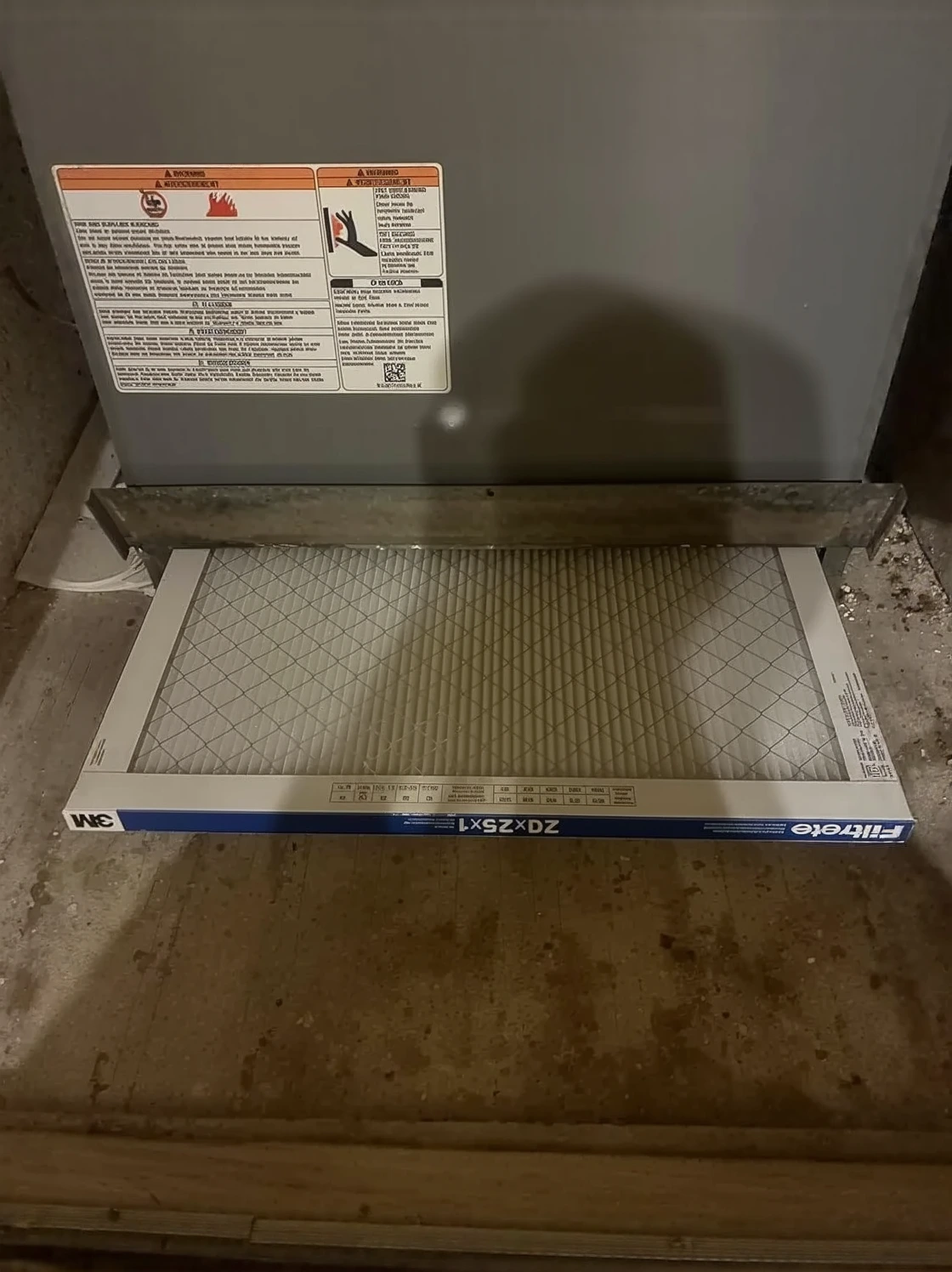 Customer photo showing air filter comparison with MERV rating labels visible