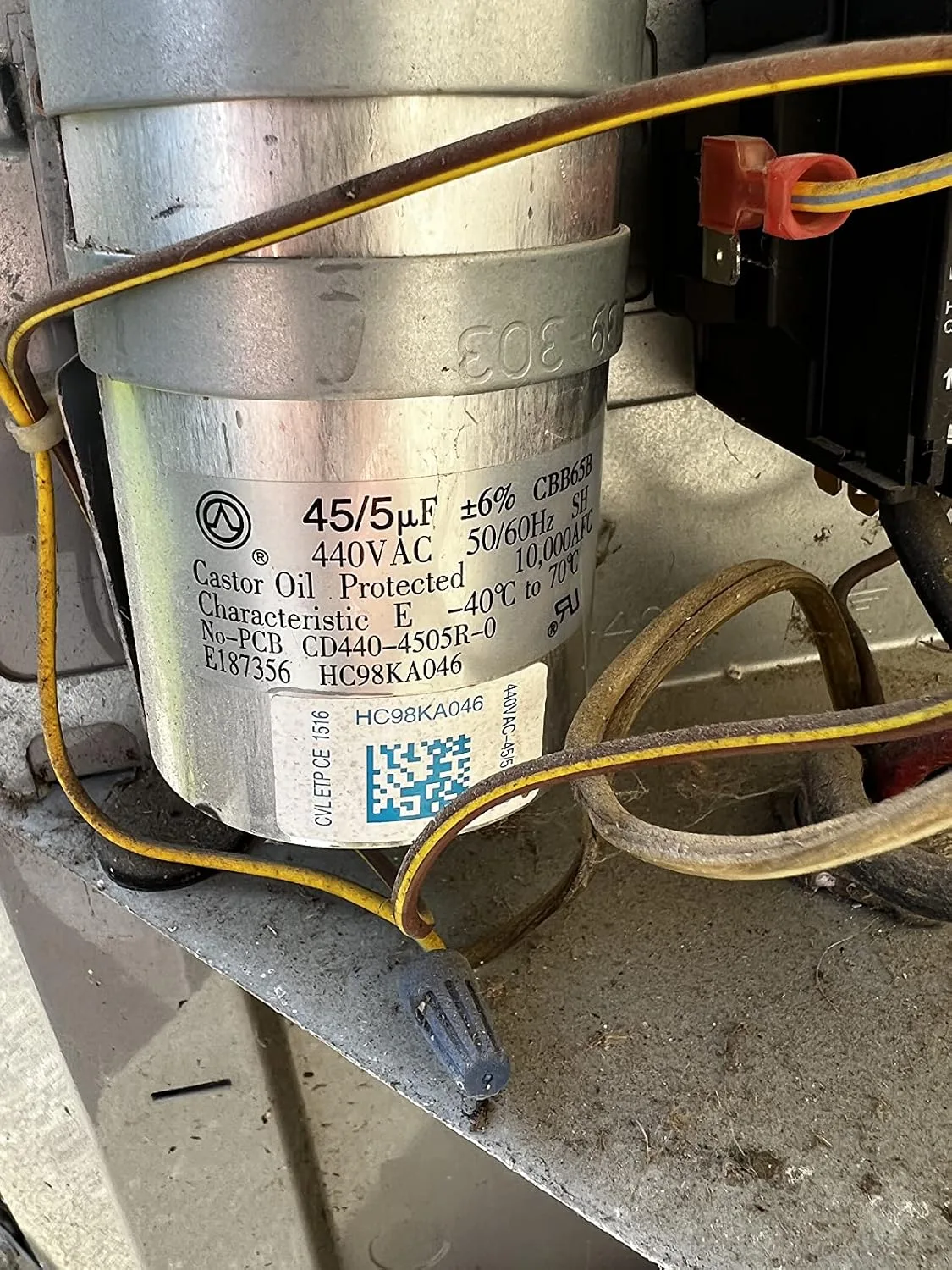 Customer photo of AC capacitor component showing dual cylindrical terminals