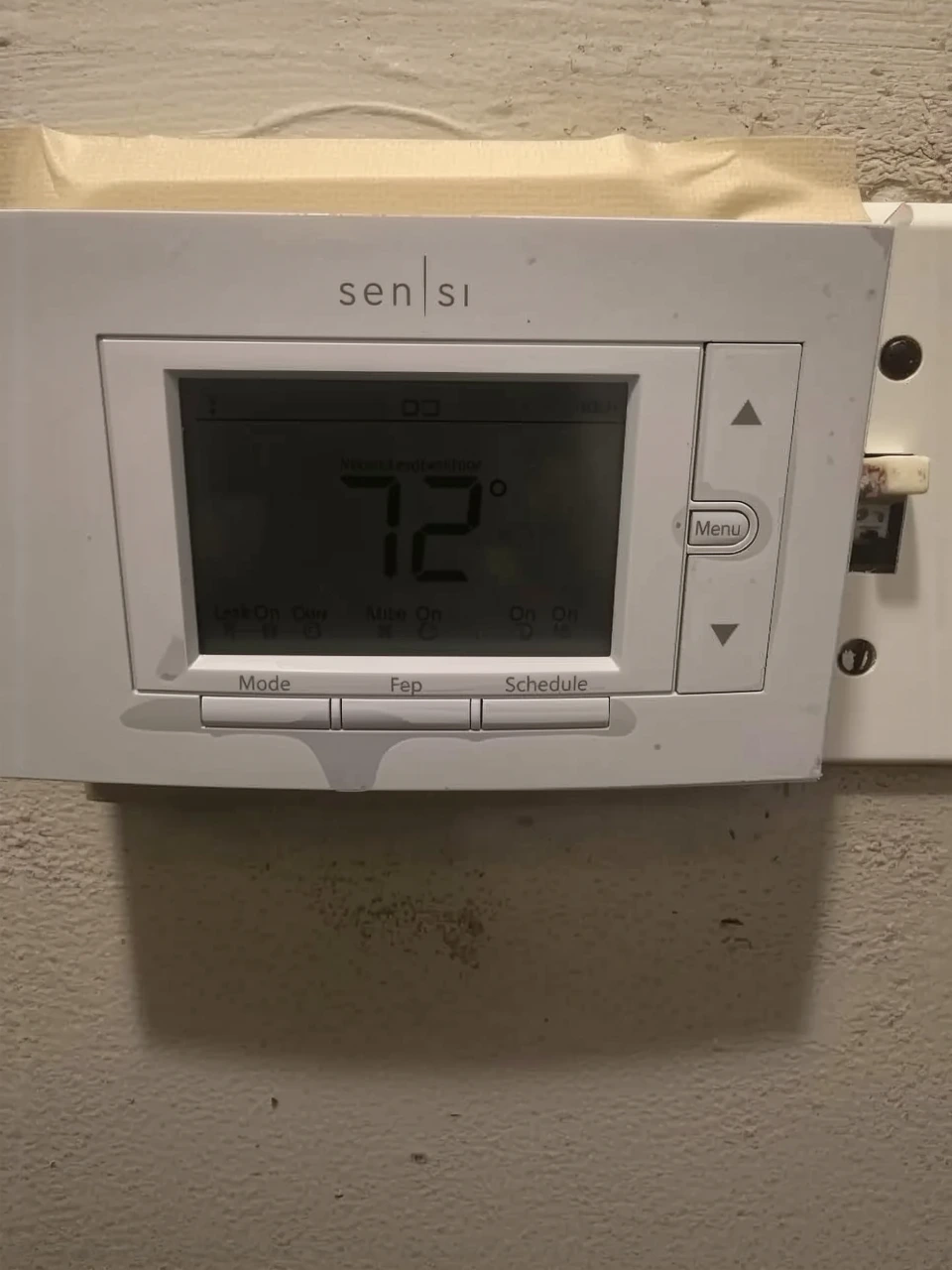 Customer photo of thermostat wiring installation showing C-wire connection terminals