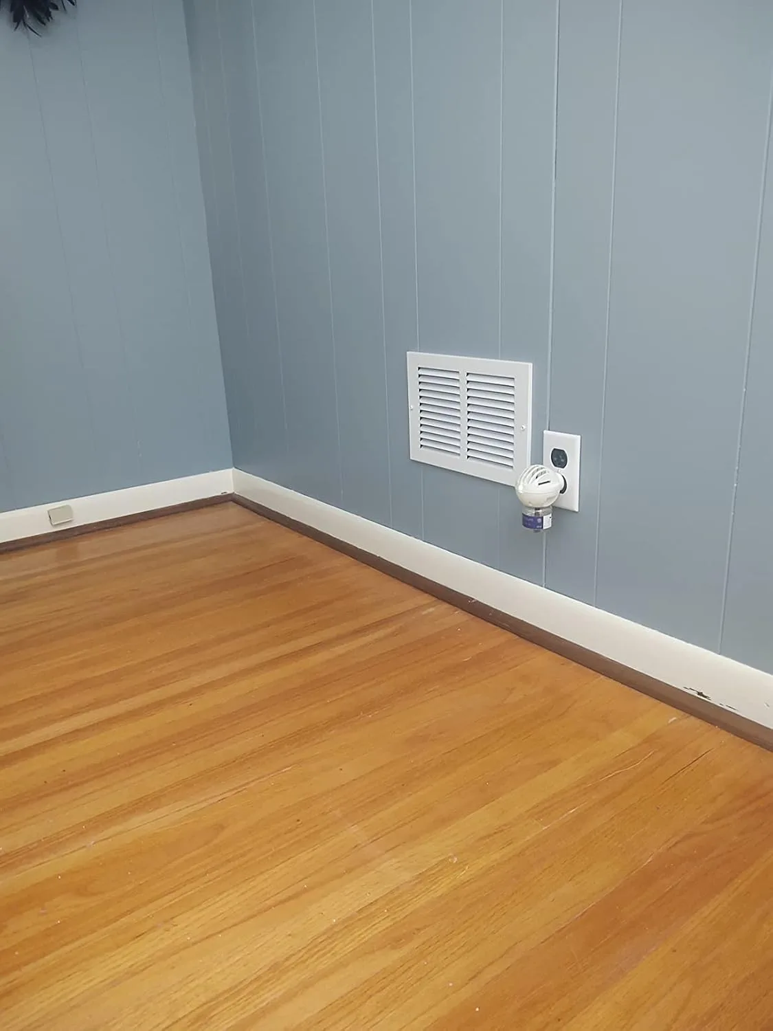 Customer photo showing HVAC vent installation behind closed bedroom door
