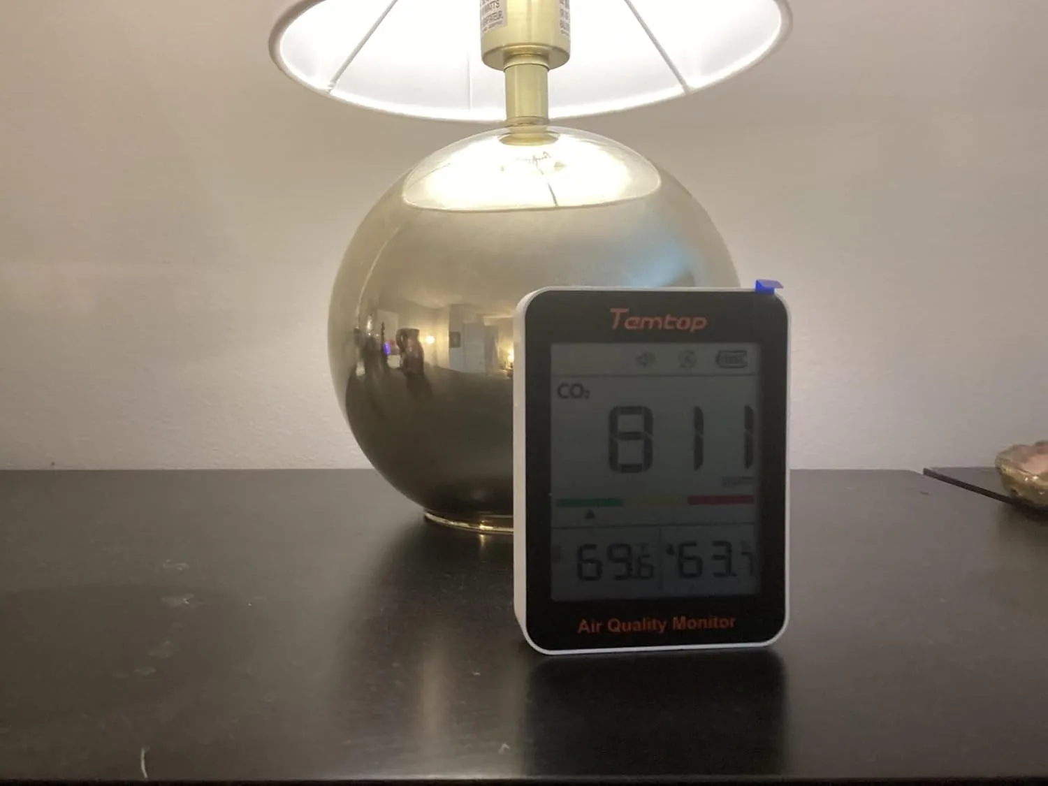 Customer photo of CO2 monitor displaying air quality reading on home shelf