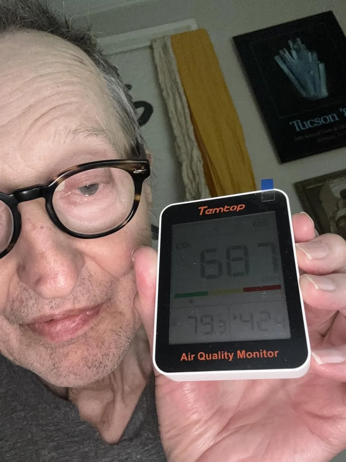 Customer photo of CO2 monitor display showing air quality reading on home wall