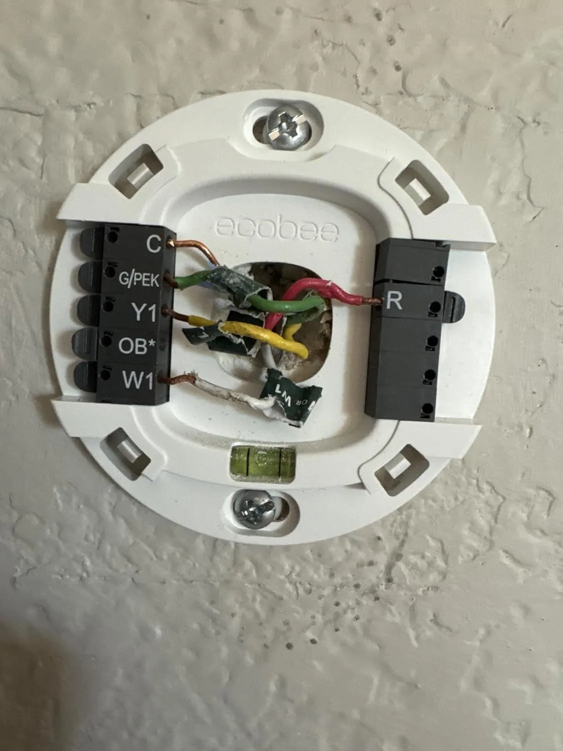 Customer photo showing C wire thermostat connection point on HVAC system