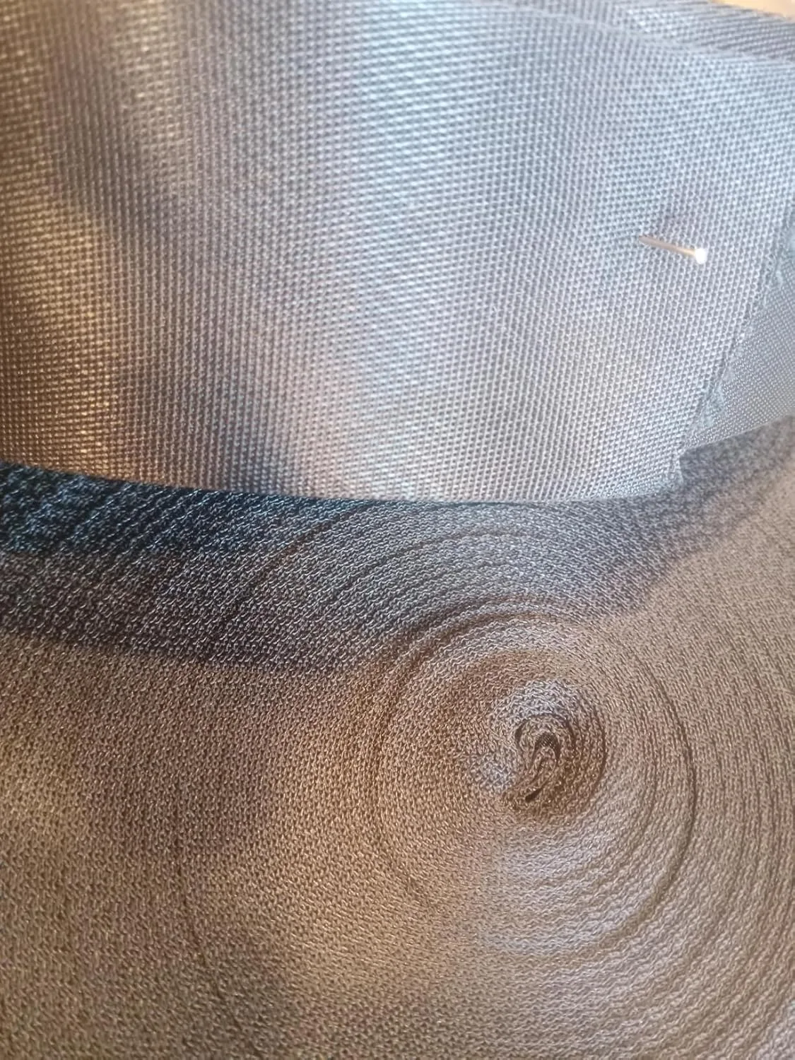 Customer photo of improperly installed flex duct with visible kinks and compression reducing airflow